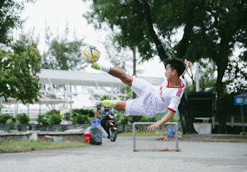 Time Lapse Photography of Soccer Player Jumping Kicking Ball