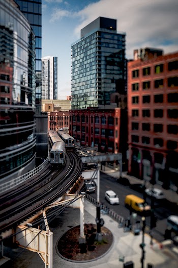 Time Lapse Photography of Train Running Near Building