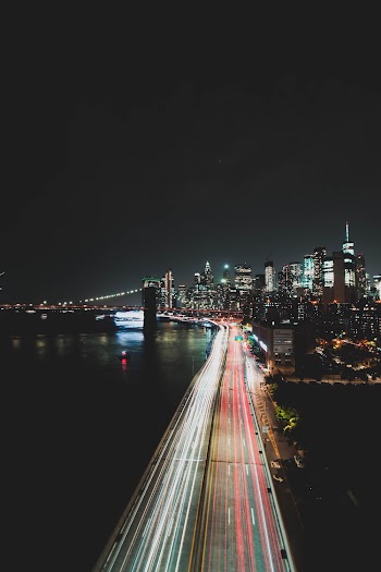 Time Lapse Photography of Vehicle on Road during Nighttime