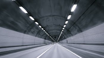 time lapse photography of vehicle under tunnel