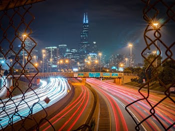 Time Lapse Photography Of Vehicles Passing On Road At Night