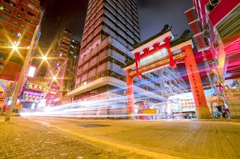 Time Lapse Photography Of Vehicles Passing Through China Town