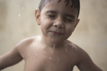 Time-lapse Photography of Water Pouring All over a Boy's Face and Body