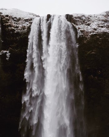 time lapse photography of waterfall during daytime