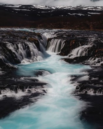 time lapse photography of waterfalls