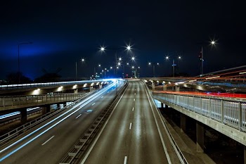 time lapsed photography of concrete curved road