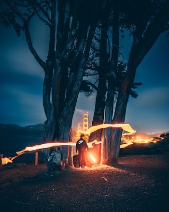 timelapse photograph of man in black Nike jacket