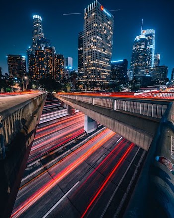 timelapse photography of city street near buildings at night