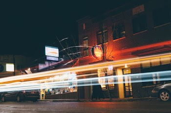 timelapse photography of signage near building