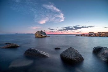 timelapse photography of stony beach during day time
