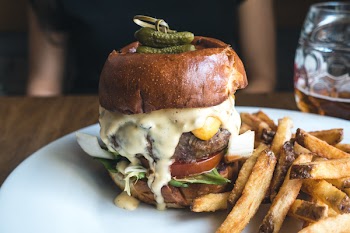 Tiny pickles on top of burger 