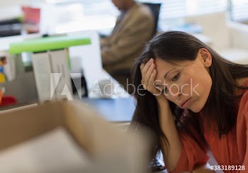 Tired stressed businesswoman in office
