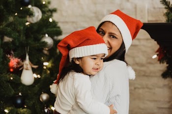 Toddler And Mom In Santa Hats