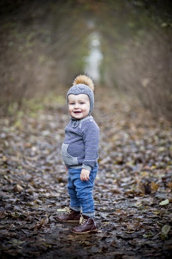 Toddler in a White and Blue Striped Jacket