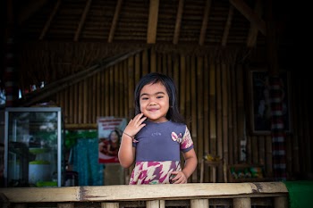 Toddler in Purple and White Dress