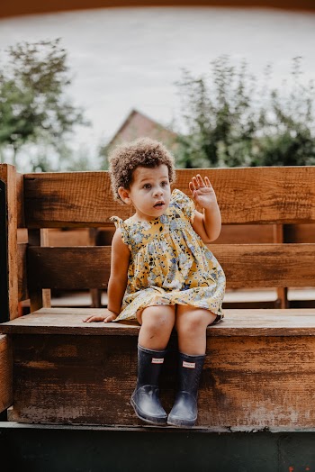 Toddler Sitting On Bench