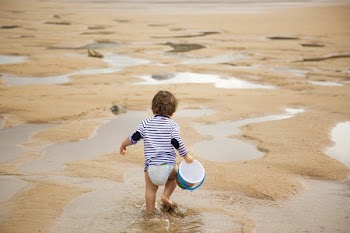 Toddler Walking on Shoreline