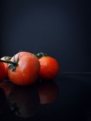 Tomato on dark background