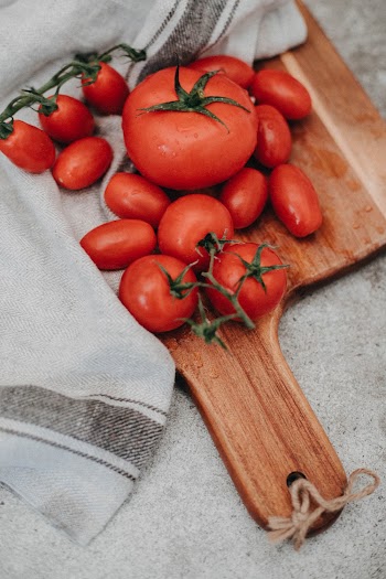 Tomatoes On Chopping Board