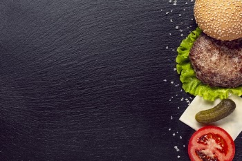 Top view burger ingredients on black background Free Photo