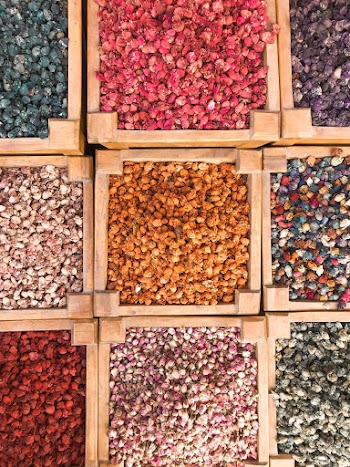 Top View Of Assorted Colored Stones in Wooden Containers