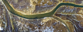 Top-view of Body of Water Separating in Two Lanes
