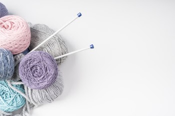 Top view of colorful wool yarn balls Free Photo