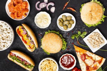 Top view of fast food meal on black table Free Photo