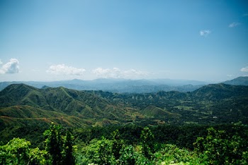 Top View of Hills and Trees Under Blue Sky