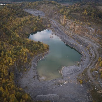 Top View Of Lake Surrounded By Trees