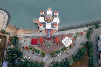 Top View of Mosque Near Body of Water