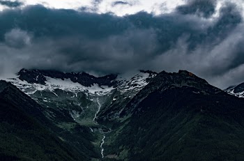 Top View of Mountains Under Gray Cloudy Sky