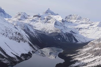 top view of river surrounded by snow mountains