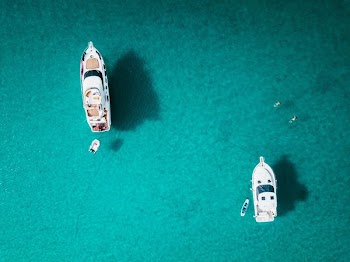 top view of two white yachts