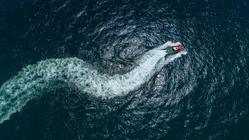 Top View Photo of Boat on Ocean