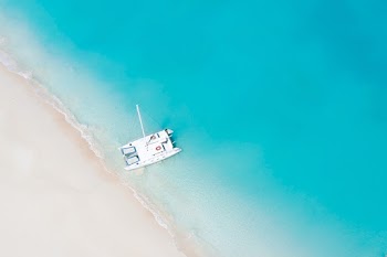 Top View Photo of Boat On Seashore