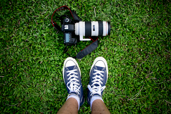 Top View Photo of Camera Near Shoes