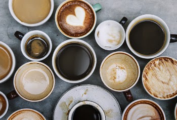 Top View Photo of Ceramic Mugs Filled With Coffees
