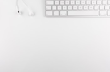 Top View Photo of Keyboard Near Earphones