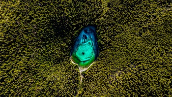 Top View Photo of Lake Surrounded By Trees