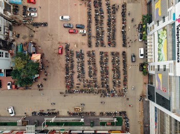 Top View Photo of Motorcycles Parked on Parking Space