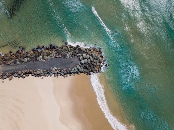 Top View Photo of Ocean and Beach Sand