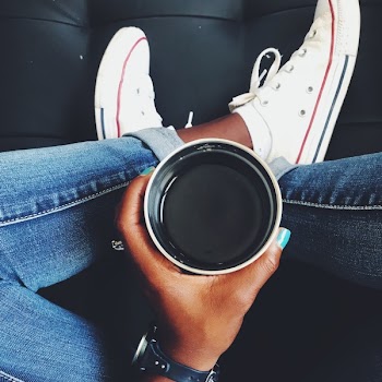 Top View Photo of Person Holding Cup