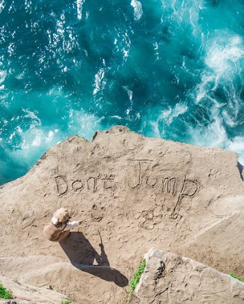 Top View Photo of Person On Seashore