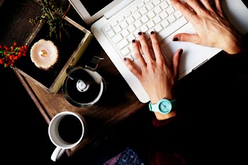 Top View Photo of Person Using White Laptop
