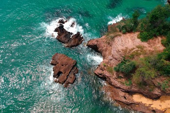 Top View Photo of Rock Formation on Body of Water