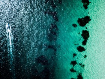 Top View Photo of Sail Boat on Sea