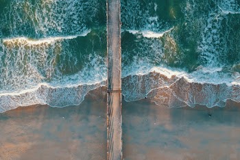 Top View Photo of Sea Waves and Dock