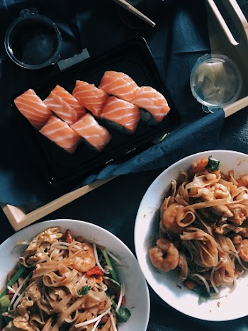 Top View Photo of Sushi and Cooked Noodles