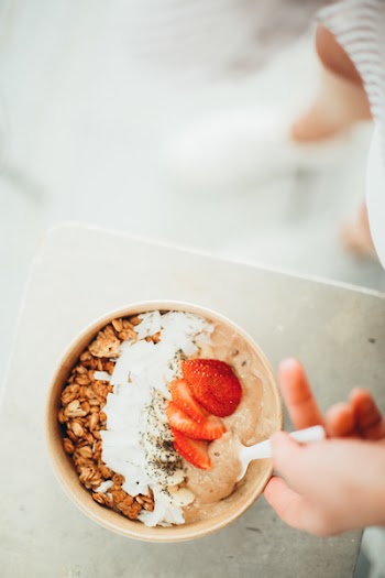 Top-view Photography of Cereals in Bowl With Strawberry